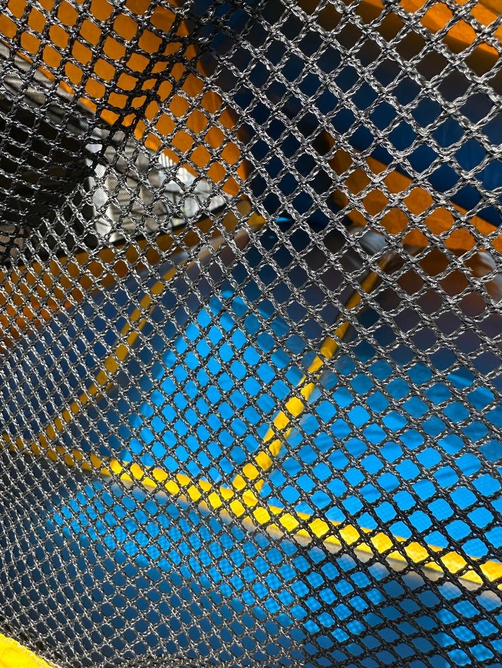 Before photo of blown internal baffle repair on a bounce house, completed by Stitches For Bounces