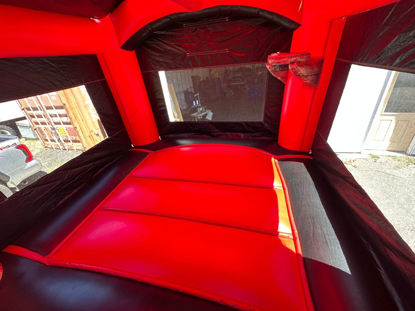 Before photo of blown internal baffle repair on a bounce house, completed by Stitches For Bounces