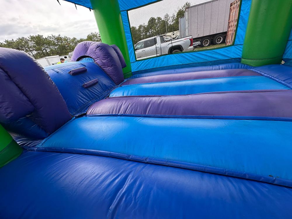 After photo of blown internal baffle repair inside a combo bounce house unit, completed by Stitches For Bounces