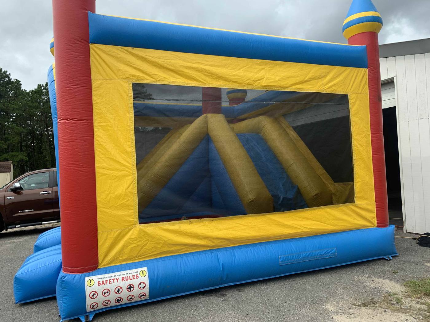 After photo of mesh window repair on an inflatable bounce house, completed by Stitches For Bounces