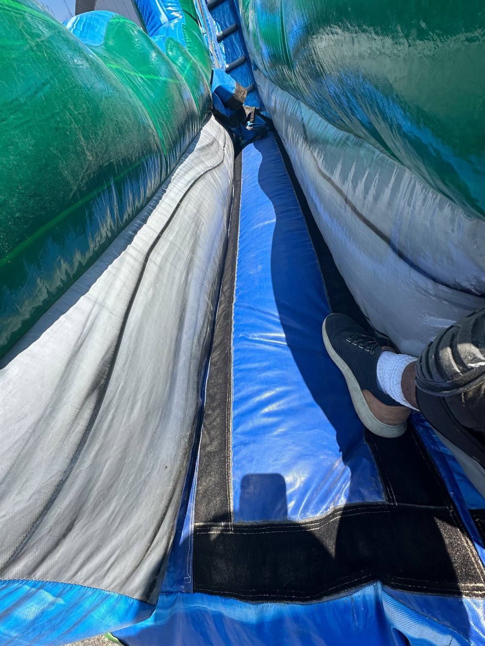 After photo of the same water slide seam closed and repaired, completed by Stitches For Bounces